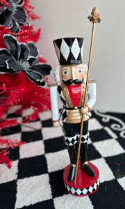 Black, Gold, and White Harlequin Soldier with Red Chest