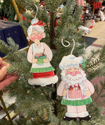 Load image into Gallery viewer, Baking Santa and Mrs. Claus Metal Ornaments in Red, White, and Green
