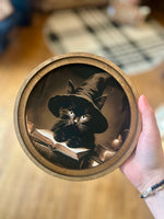 Load image into Gallery viewer, Black Cat with Witch Hat and Spell Book 8” Round Framed Picture
