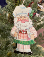 Load image into Gallery viewer, Baking Santa and Mrs. Claus Metal Ornaments in Red, White, and Green
