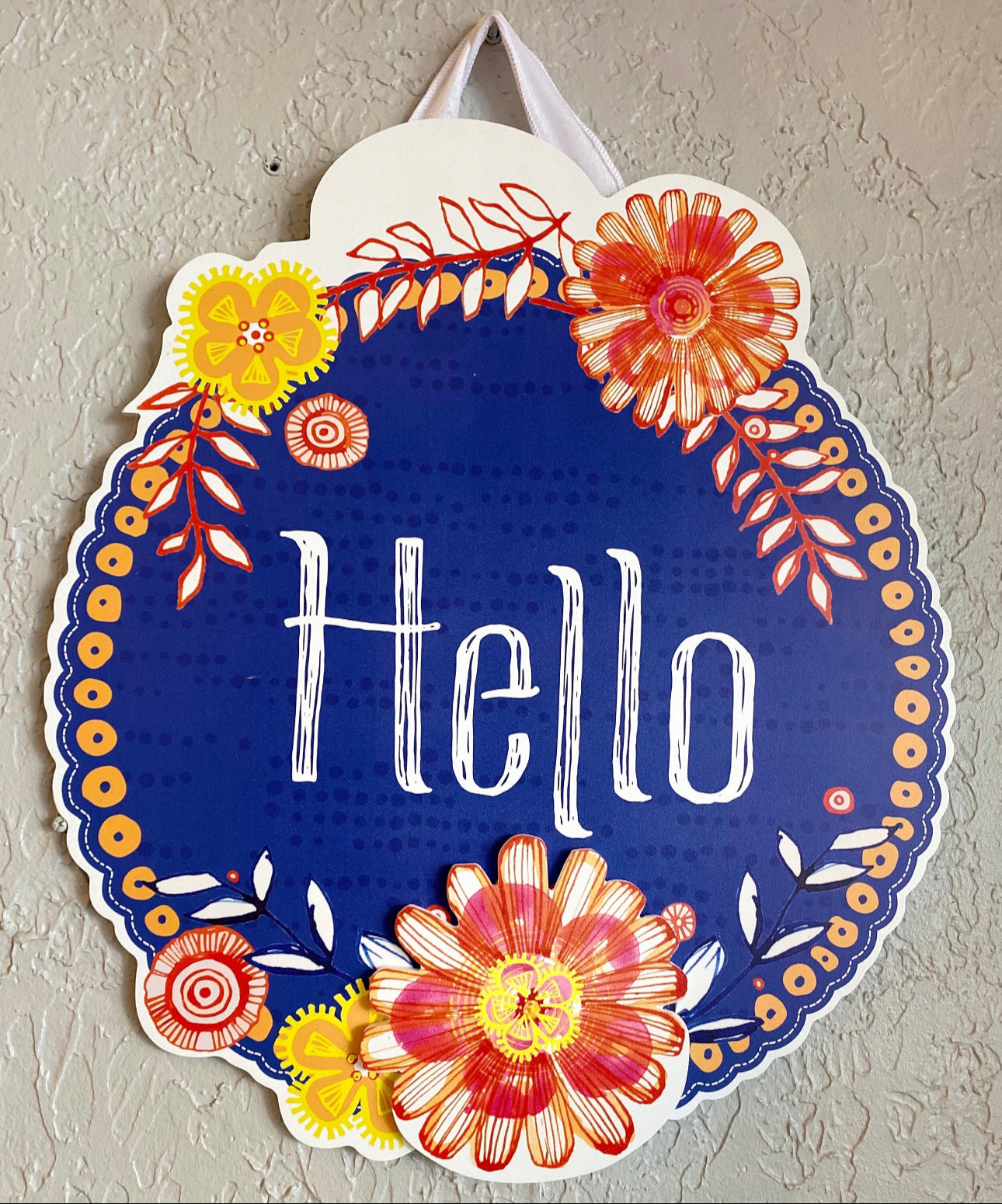 Hello Blue Background Door Hanger with Bordering Orange & Yellow Flowers