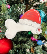 Load image into Gallery viewer, Dog Bone Santa Hat Metal Red &amp; White Ornament
