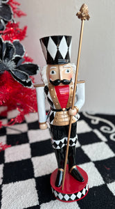 Black, Gold, and White Harlequin Soldier with Red Chest