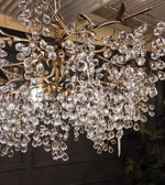 Load image into Gallery viewer, Glicina 8-Light Chandelier in Natural Brass by Quorum International
