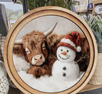 Load image into Gallery viewer, Cow Sleeping by Red White Hat Snowman Round Wood Frame Christmas Decor
