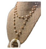 Load image into Gallery viewer, Gold and White Half Horn Pendant with Ivory Fringe and Cream Gold Beaded Necklace
