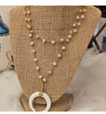 Load image into Gallery viewer, Gold and White Half Horn Pendant with Ivory Fringe and Cream Gold Beaded Necklace
