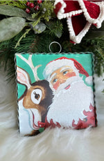 Load image into Gallery viewer, Santa with Rudolph and Turquoise Background Mini Print
