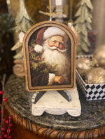 Load image into Gallery viewer, Arch Top Wooden Classic Santa Art in Burgundy or Round Wood Frame
