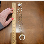 Load image into Gallery viewer, Gold and White Half Horn Pendant with Ivory Fringe and Cream Gold Beaded Necklace
