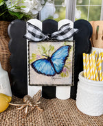 Load image into Gallery viewer, Blue Butterfly Galvanized Framed Mini Print with Floral Accents
