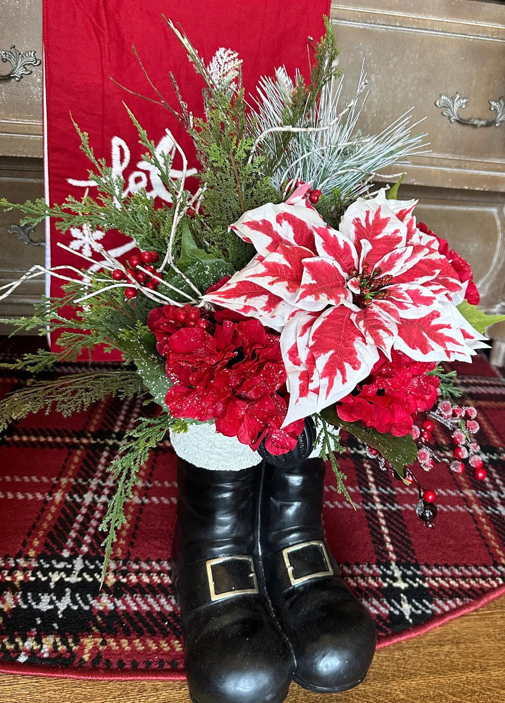 Christmas Red and White Peppermint Poinsettia Arrangement in Resin Black Santa Boots