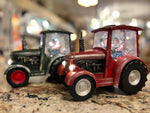 Load image into Gallery viewer, Red or Green Tractor Snow Globe with Santa driving, Tractor lights up
