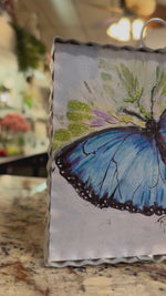 Load and play video in Gallery viewer, Blue Butterfly Galvanized Framed Mini Print with Floral Accents
