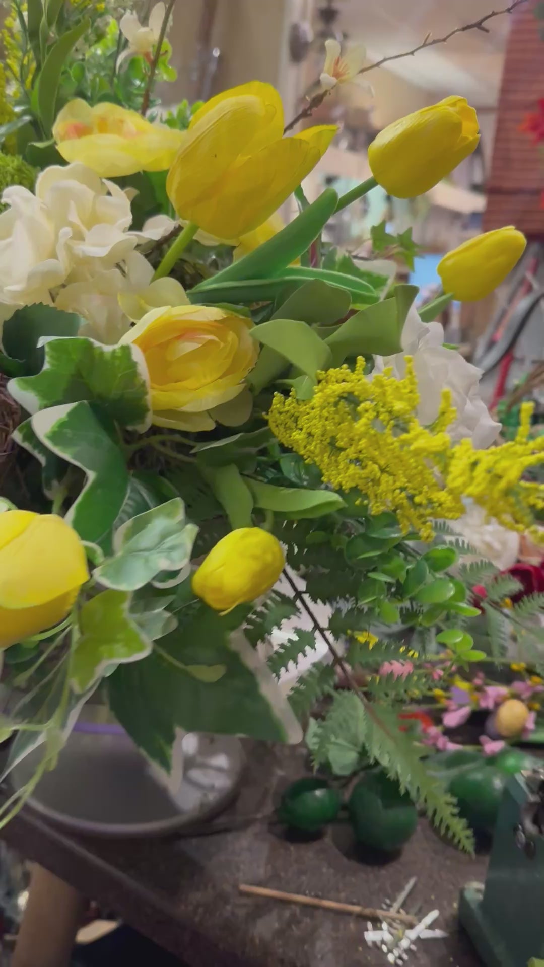 Yellow, White, and Mixed Greenery Birds Nest Arrangement