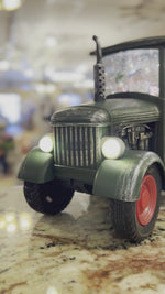 Load and play video in Gallery viewer, Red or Green Tractor Snow Globe with Santa driving, Tractor lights up
