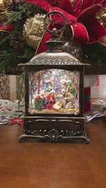 Load and play video in Gallery viewer, Nativity Holy Family Bronze Lantern Snow Globe with Light
