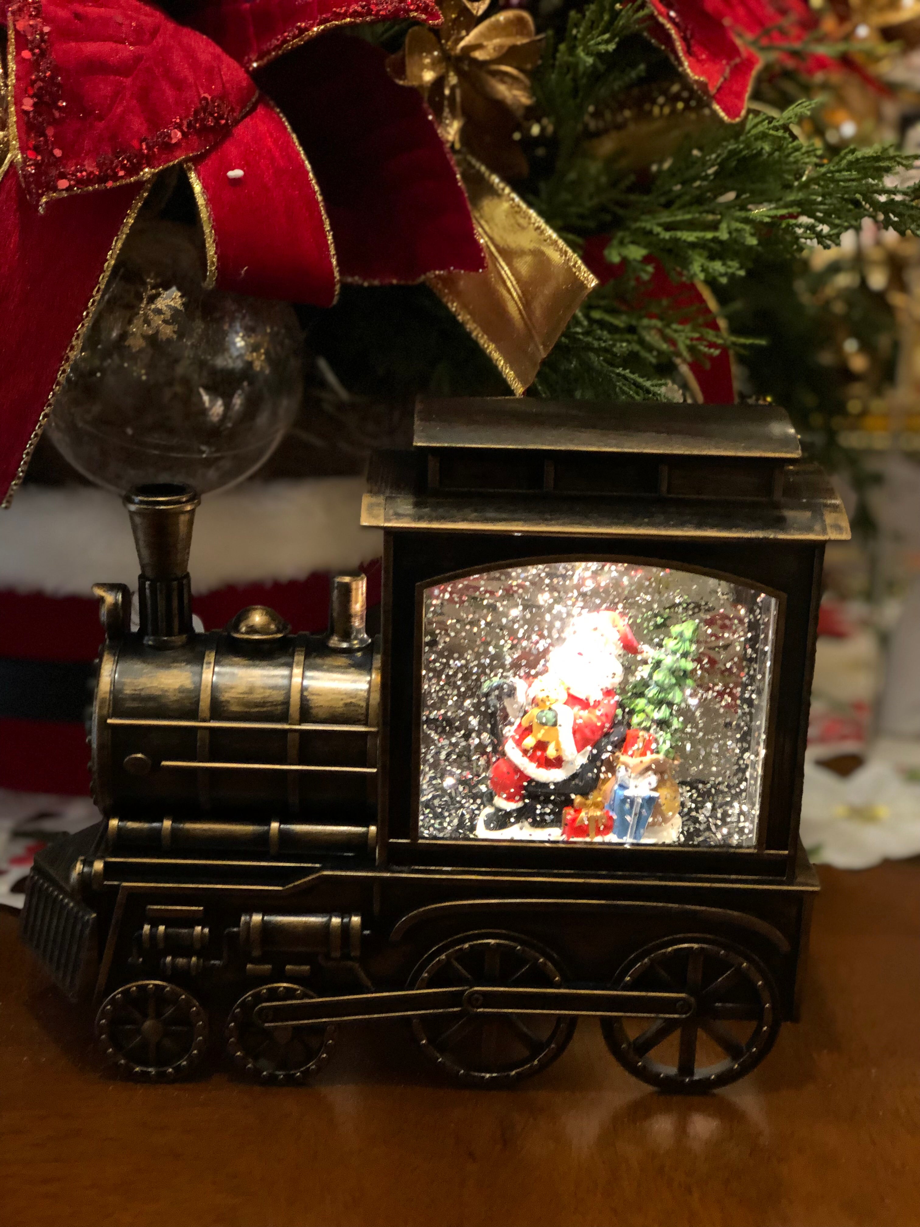 Santa Clause in Bronze Train Snow Globe LED