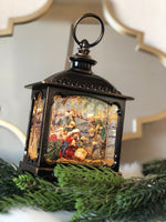 Load image into Gallery viewer, Nativity Holy Family Bronze Lantern Snow Globe with Light
