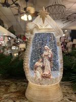 Load image into Gallery viewer, Snow globe with Holy Family LED Manger Scene and Star
