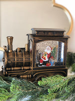 Load image into Gallery viewer, Santa Clause in Bronze Train Snow Globe LED
